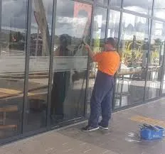 Streaky window before professional window cleaning in Salford