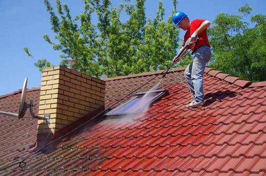 Clean bungalow roof tiles after low-pressure moss removal in Manchester